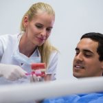 dental implants vs dentures which lasts longer and costs less over time